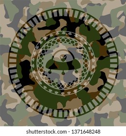 ufo with aline inside icon on camouflaged pattern