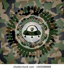 ufo with aline inside icon on camo pattern