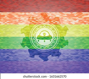 ufo with aline inside icon on mosaic background with the colors of the LGBT flag