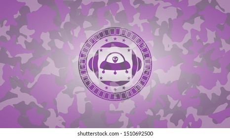 ufo with aline inside icon inside pink and purple camo emblem