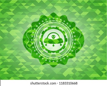 ufo with aline inside icon inside realistic green emblem. Mosaic background