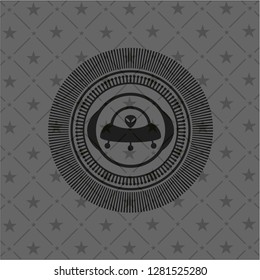 ufo with aline inside icon inside realistic black emblem