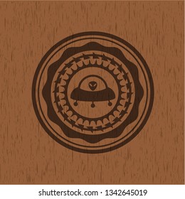 ufo with aline inside icon inside realistic wooden emblem