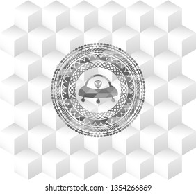 ufo with aline inside icon inside realistic grey emblem with cube white background