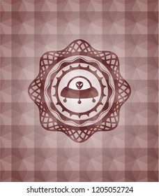 ufo with aline inside icon inside red seamless emblem with geometric pattern background.