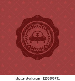ufo with aline inside icon inside red emblem. Vintage.