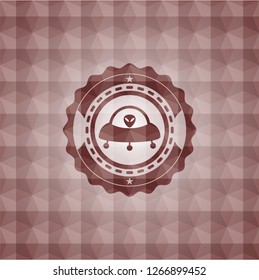 ufo with aline inside icon inside red seamless geometric emblem.