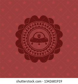 ufo with aline inside icon inside red icon or emblem