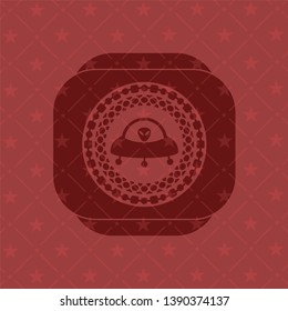 ufo with aline inside icon inside red emblem