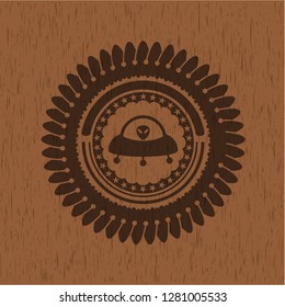 ufo with aline inside icon inside retro style wooden emblem