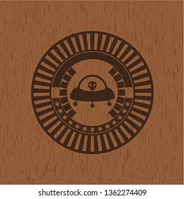 ufo with aline inside icon inside retro style wood emblem