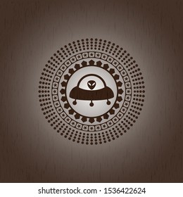 ufo with aline inside icon inside retro style wood emblem