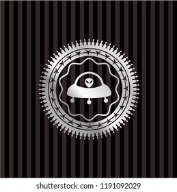 ufo with aline inside icon inside silver shiny emblem