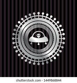 ufo with aline inside icon inside silver badge or emblem