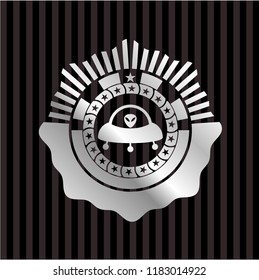 ufo with aline inside icon inside silvery shiny emblem