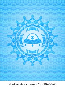 ufo with aline inside icon inside sky blue water badge.