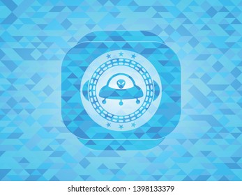 ufo with aline inside icon inside sky blue emblem with triangle mosaic background