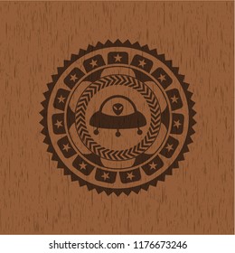ufo with aline inside icon inside vintage wood emblem
