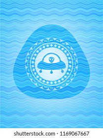 ufo with aline inside icon inside water wave concept badge background.