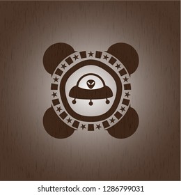 ufo with aline inside icon inside wood emblem. Retro
