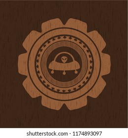 ufo with aline inside icon inside wooden emblem