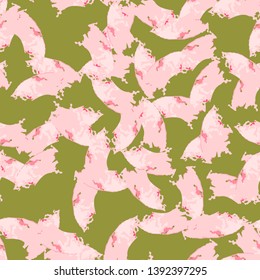 UFO camouflage of various shades of red, green and pink colors. It is a colorful seamless pattern that can be used as a camo print for clothing and background and backdrop or computer wallpaper