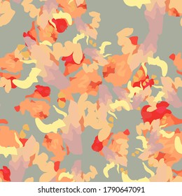 UFO camouflage of various shades of red, pink, grey and yellow colors. It is a colorful seamless pattern that can be used as a camo print for clothing and background and backdrop or computer wallpaper