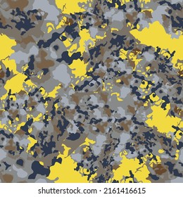 UFO camouflage of various shades of yellow, grey, brown and blue colors. It is a colorful seamless pattern that can be used as a camo print for clothing and background and backdrop or computer wallpap