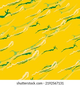UFO camouflage of various shades of yellow and green colors. It is a colorful seamless pattern that can be used as a camo print for clothing and background and backdrop or computer wallpaper