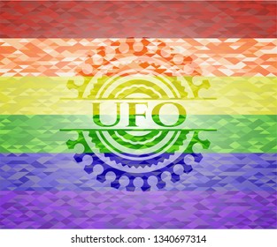 UFO emblem on mosaic background with the colors of the LGBT flag