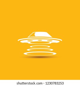 Ufo flying saucer vector icon isolated on orange background. Ufo logo design template