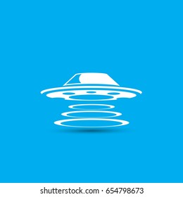 Ufo flying saucer vector icon isolated on blue background. Ufo logo design template