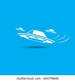 Ufo flying saucer vector icon isolated on blue background. Ufo logo design template