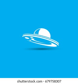 Ufo flying saucer vector icon isolated on blue background. Ufo logo design template