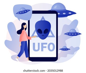 UFO spaceships. Alien sign on smartphone screen. UFO spaceships. Space concept. Futuristic unknown flying object. World Contact day. Modern flat cartoon style. Vector illustration on white background