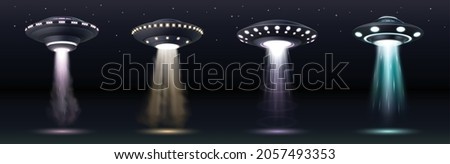 UFO spaceships. Realistic alien space ships with light beam, smoke and sparkles over dark sky with stars. Saucers with bright illumination and vertical ray for abduction. Realistic vector illustration