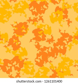 UFO urban camouflage of various shades of orange and yellow colors. It is a colorful seamless pattern that can be used as a camo print for clothing and background and backdrop or computer wallpaper