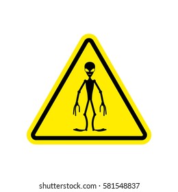 UFO Warning sign yellow. Alien Hazard attention symbol. Danger road sign triangle invader
