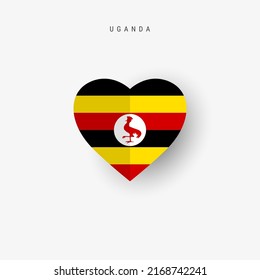 Uganda heart shaped flag. Origami paper cut Ugandan national banner. 3D vector illustration isolated on white with soft shadow.