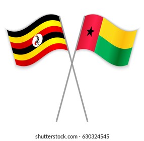 Ugandan and Bissau-Guinean crossed flags. Uganda combined with Guinea_Bissau isolated on white. Language learning, international business or travel concept.