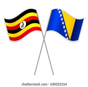 Ugandan and Bosnian crossed flags. Uganda combined with Bosnia and Herzegovina isolated on white. Language learning, international business or travel concept.