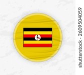 Ugandan Flag in a Circular Emblem Design, Abstract Round Sticker Illustration. This high-quality vector graphic is perfect for use in patriotic designs, international events, sport competitions.