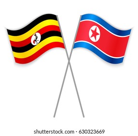 Ugandan and North Korean crossed flags. Uganda combined with North Korea isolated on white. Language learning, international business or travel concept.
