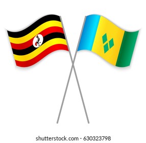 Ugandan and Vincentian crossed flags. Uganda combined with Saint Vincent and the Grenadines isolated on white. Language learning, international business or travel concept.