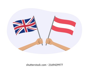 UK and Austria flags. Greek and Austrian national symbols. Hand holding waving flag. Vector illustration.