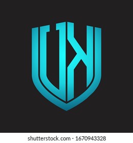 UK Logo monogram with emblem shield design isolated with blue colors on black background