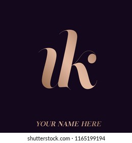 UK monogram logo.Elegant icon with letter u and letter k, in rose gold metallic color isolated on dark background.Typographic elements.