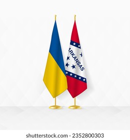 Ukraine and Arkansas flags on flag stand, illustration for diplomacy and other meeting between Ukraine and Arkansas. Vector illustration.
