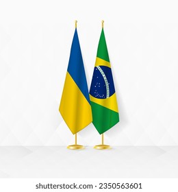 Banderas de Ucrania y Brasil en el puesto de bandera, ilustración para la diplomacia y otro encuentro entre Ucrania y Brasil. Ilustración vectorial.