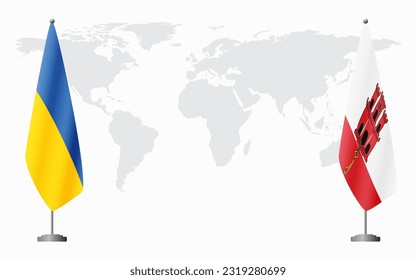 Ukraine and Gibraltar flags for official meeting against background of world map.